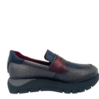 Navy loafer with red interior on a white background