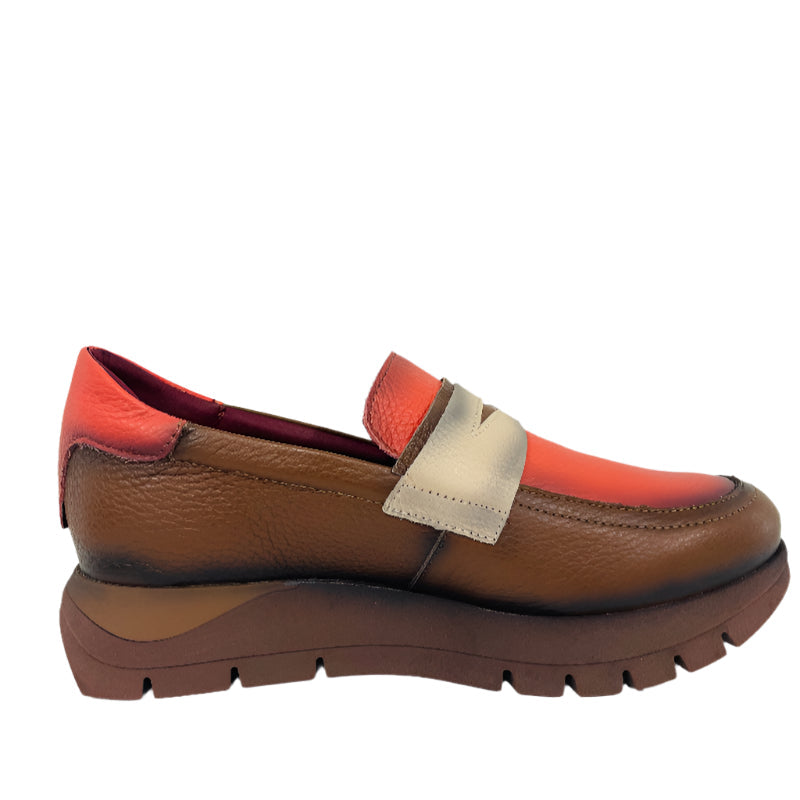 Brown and orange loafer shoe on a white background