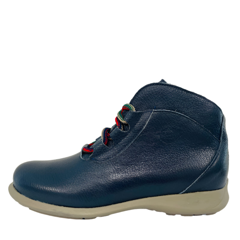 Navy blue leather shoe with red and green laces on a white background