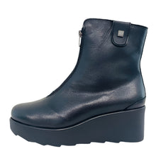 Load image into Gallery viewer, Black leather ankle boot on a white surface with a light gray wall background
