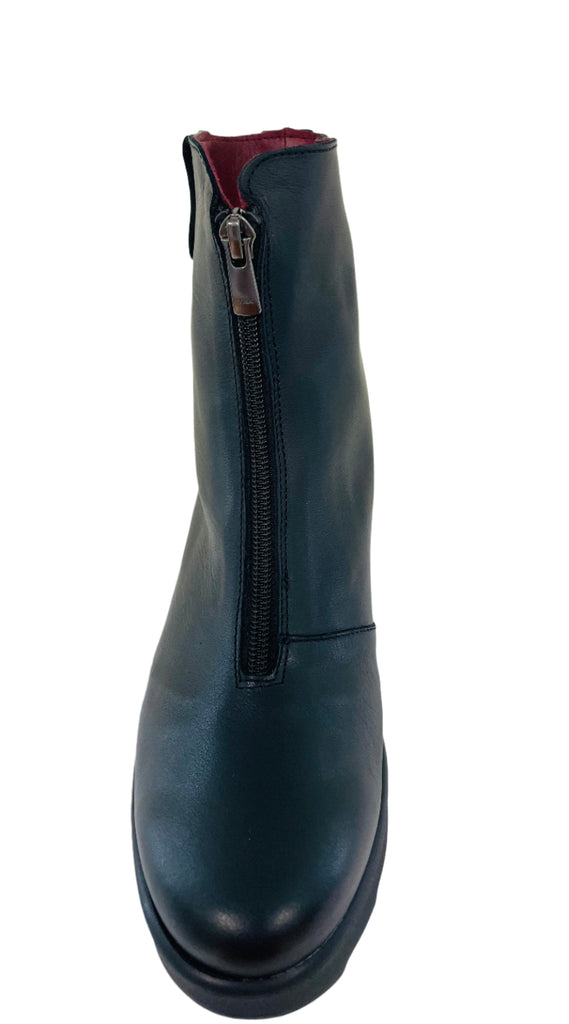 Black boot with a zipper on a white background