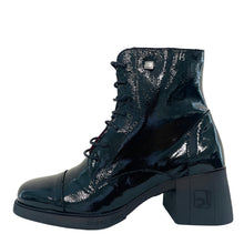Load image into Gallery viewer, Black patent leather boot on a white surface with a light gray wall background
