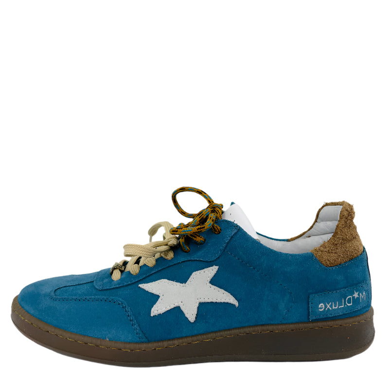 Blue sneaker with a white star on a white surface