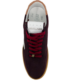 Maroon sneaker with a white star on a white background
