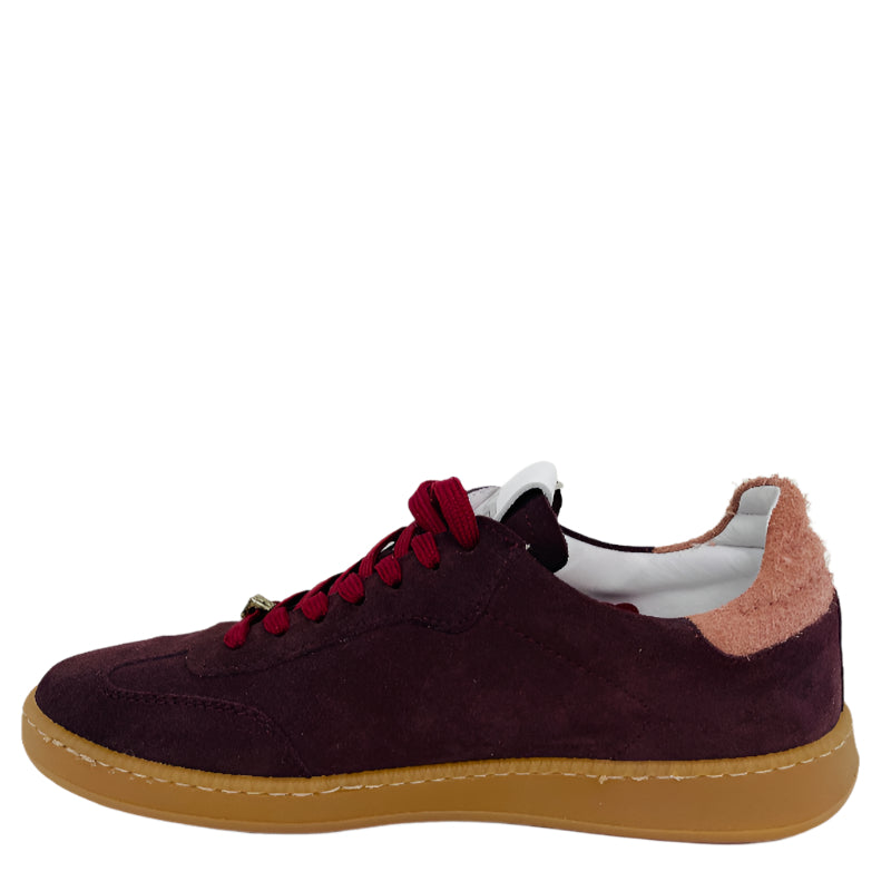 Brown suede sneaker with red laces on a white background