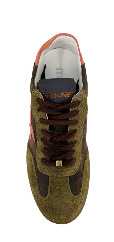 Green and brown sneaker on a white surface