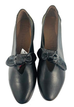Load image into Gallery viewer, Black shoes with velvet bows on a white surface
