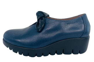 Blue shoe with a platform sole on a white background