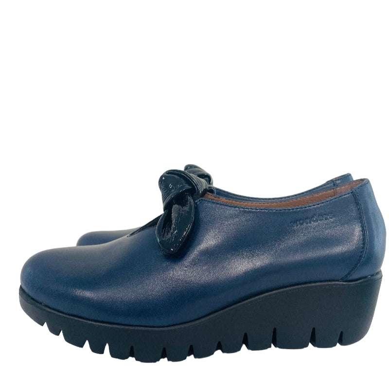 Blue shoe with a bow on a white background