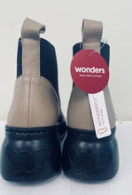 Load image into Gallery viewer, Pair of shoes with &#39;wonders&#39; branding on a white background
