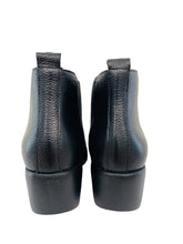 Load image into Gallery viewer, Pair of black leather ankle boots on a white surface with a light-colored wall background.
