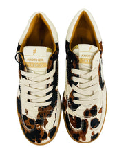 Load image into Gallery viewer, Pair of leopard print sneakers with white laces on a light background
