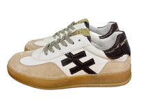 Load image into Gallery viewer, Pair of white and brown sneakers on a wooden surface with a white wall background.
