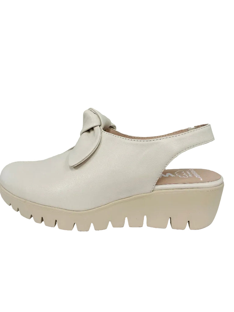 White shoe with a platform sole on a white background
