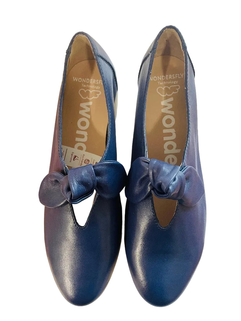 Pair of blue shoes with bows on a white surface