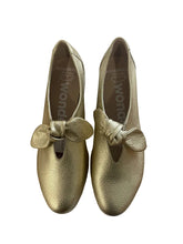 Load image into Gallery viewer, Gold shoes with bow details on a white surface
