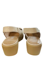 Load image into Gallery viewer, Pair of beige sandals on a surface with a window in the background
