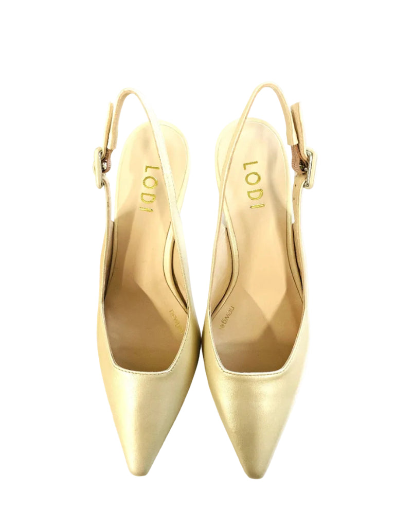 Pair of beige high-heeled shoes with 'LODI' branding on a white box against a wooden surface.