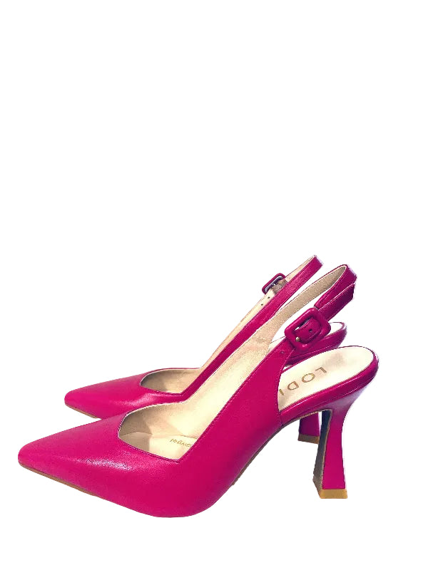Pair of bright pink high-heeled shoes on a white surface with a window in the background.