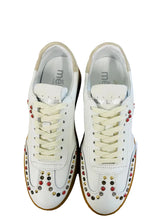 Load image into Gallery viewer, White sneakers with colorful embellishments on a white background
