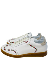 Load image into Gallery viewer, White sneakers with colorful embellishments on a white surface.

