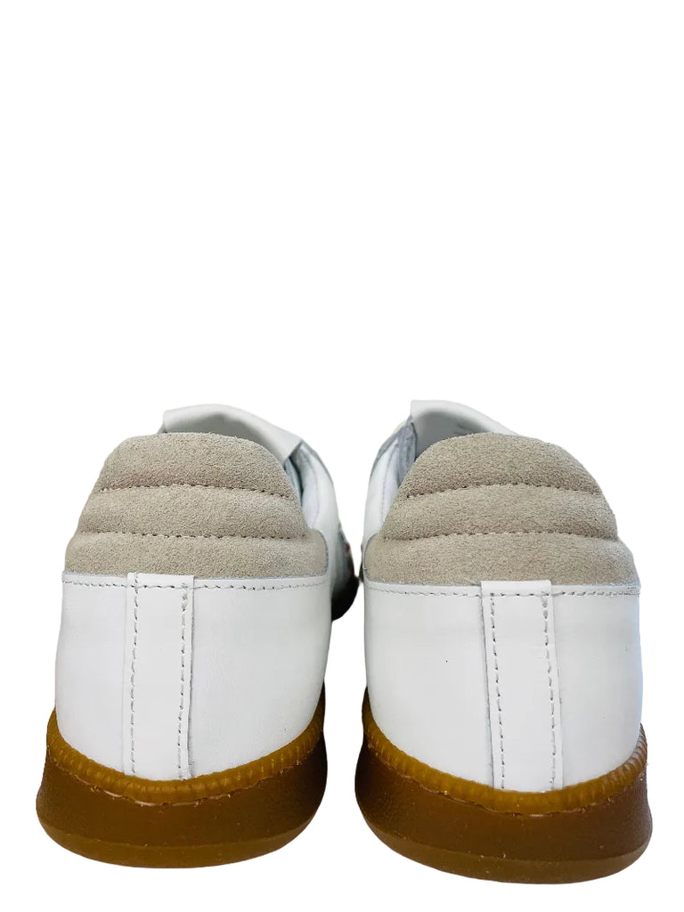 Pair of white sneakers with brown soles on a white surface.