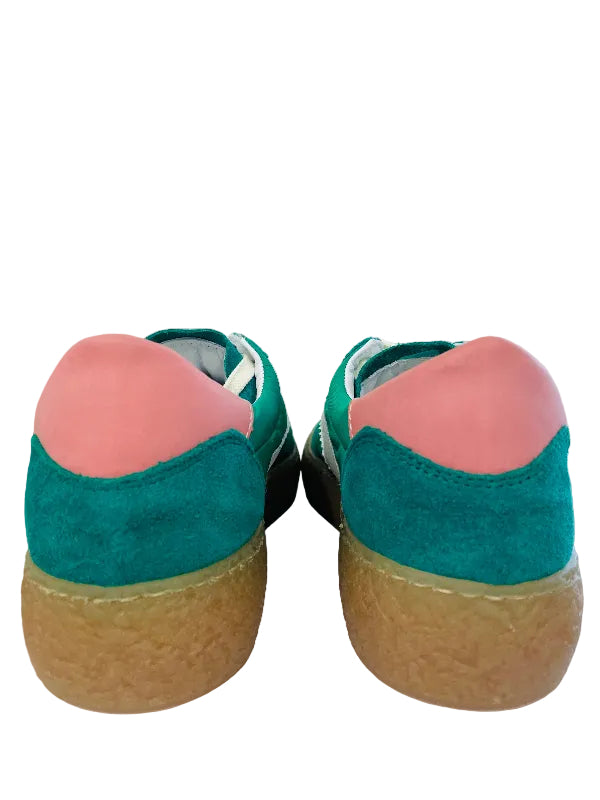 Pair of shoes with green and pink design on a white surface.