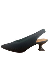 Load image into Gallery viewer, Black high-heeled shoe  with a white wall background

