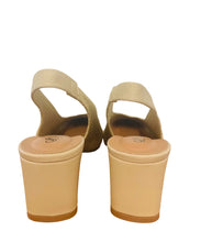 Load image into Gallery viewer, Pair of beige high-heeled sandals on a wooden surface with a blurred background

