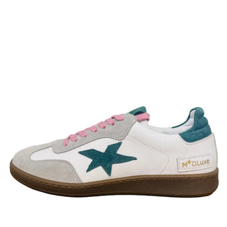 White sneaker with green star and pink laces on a wooden surface