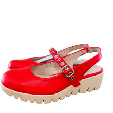 Load image into Gallery viewer, Red platform clogs with white soles on a wooden surface
