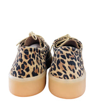 Load image into Gallery viewer, Pair of leopard print sneakers on a wooden surface with a white wall background
