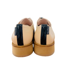 Load image into Gallery viewer, Pair of beige shoes with black soles on a wooden surface
