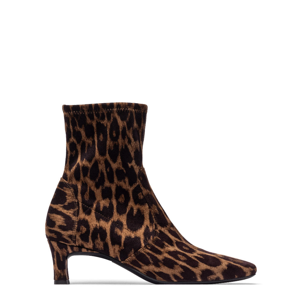 A leopard print ankle boot with a pointed toe and a low block heel, shown from a side profile on a white background.