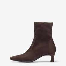 Load image into Gallery viewer, A dark brown suede ankle boot with a pointed toe and a slim kitten heel, shown in profile against a light gray background.
