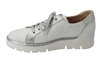 Load image into Gallery viewer, White sneaker with a platform sole on a light gray background
