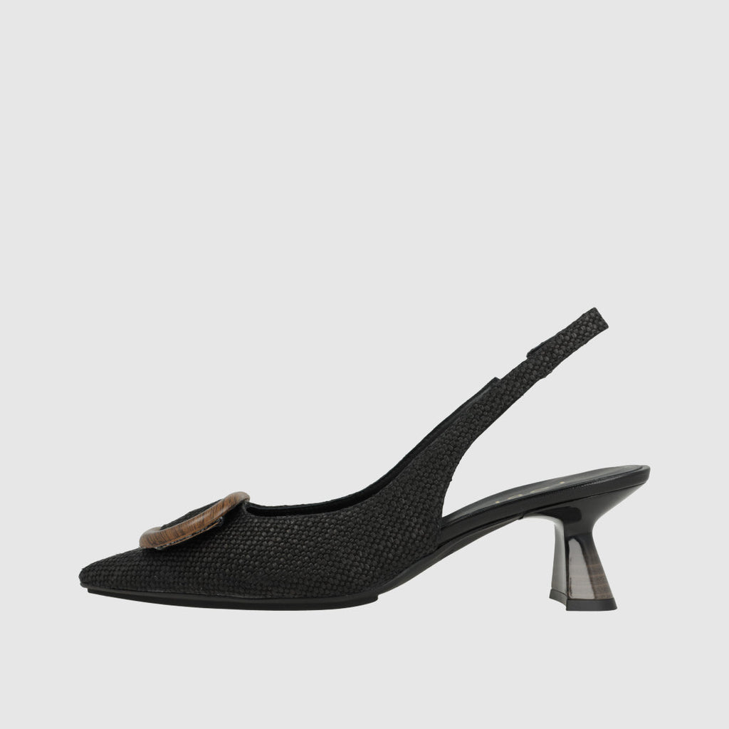 Black slingback shoe with a decorative bow on a light gray background