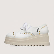 Load image into Gallery viewer, White platform shoes with studded details on a light gray background
