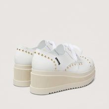 Load image into Gallery viewer, White sneakers with platform sole and studded details on a light gray background
