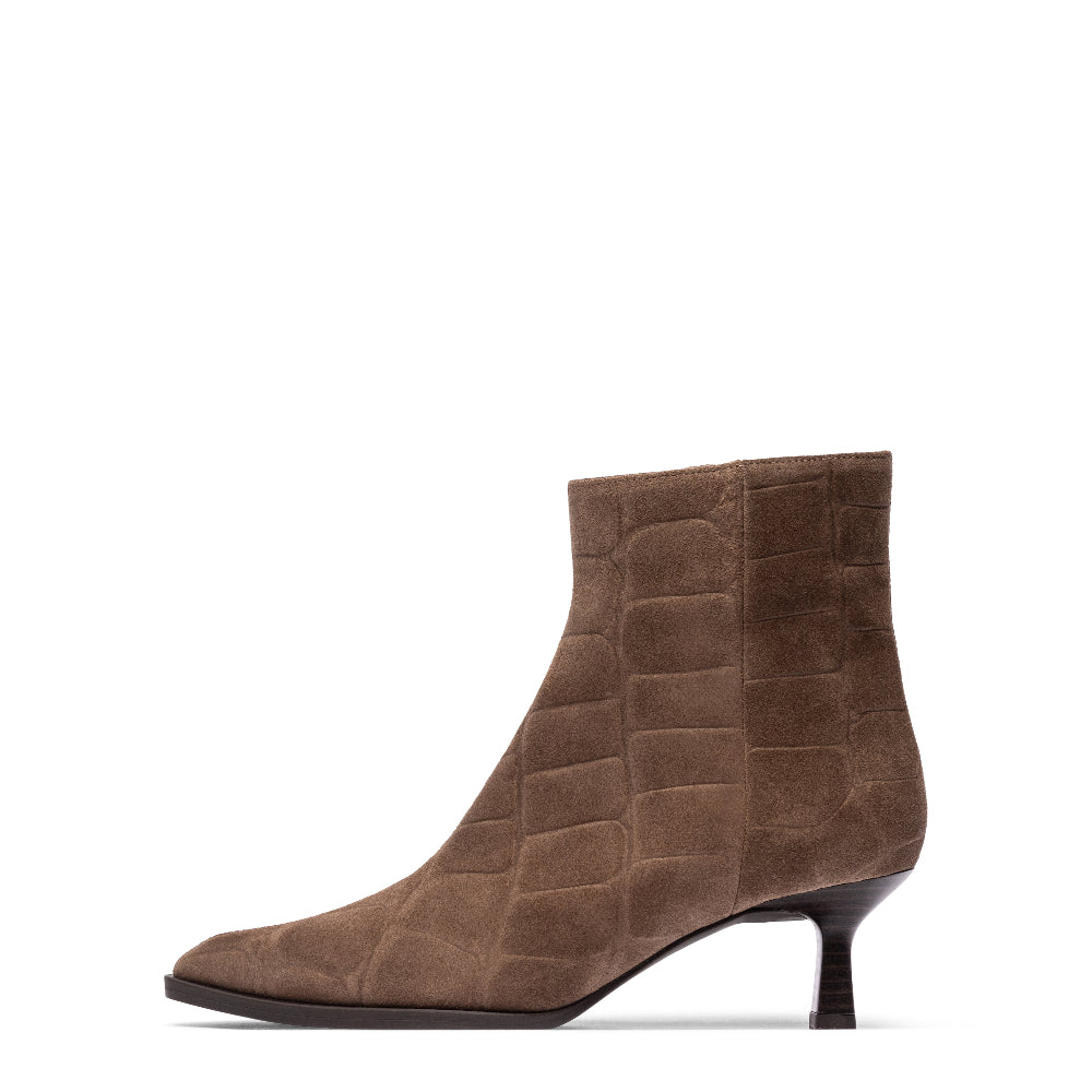 A single brown ankle boot with a textured crocodile-embossed finish, a pointed toe, and a slim kitten heel, shown against a plain white background.