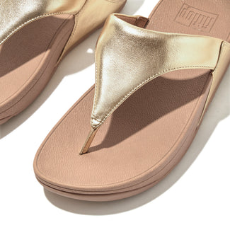 Gold and beige sandal on a white background