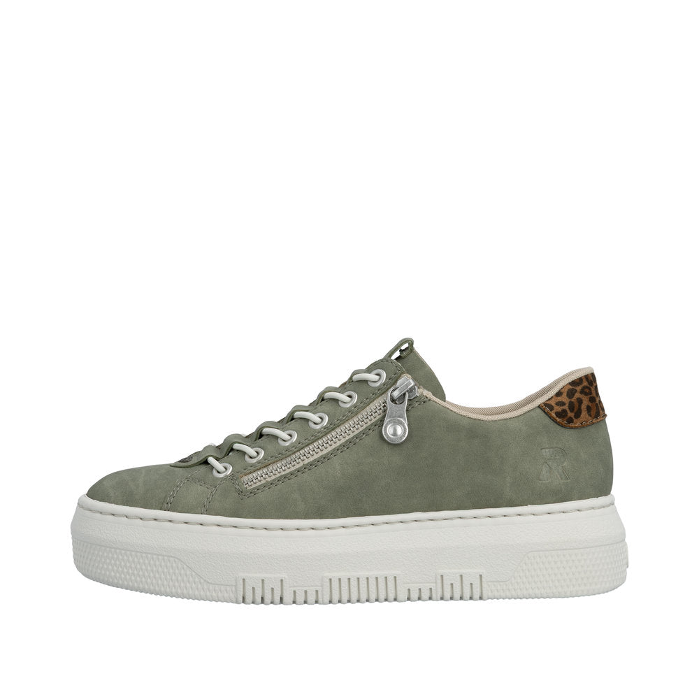 Green sneaker with leopard print heel tab on a white background