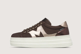 Brown sneaker with white logo on a light gray background