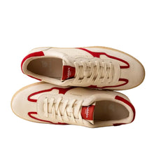 Load image into Gallery viewer, White sneakers with red accents on a beige background
