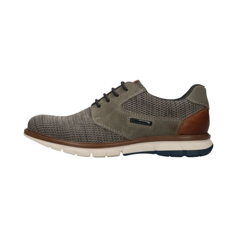 Green casual shoe with brown accents on a white background