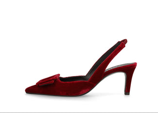 A single red velvet slingback high heel shoe with a pointed toe and a small bow detail on the vamp, shown against a plain white background.