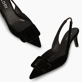 A single black pointed-toe slingback high heel shoe with a small bow detail on the toe, shown in profile against a plain white background.