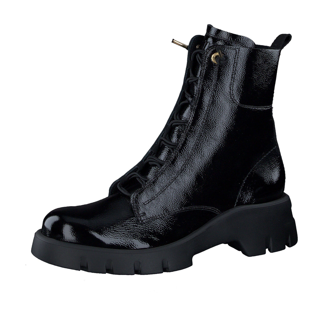 Black leather boot with a thick sole on a white background