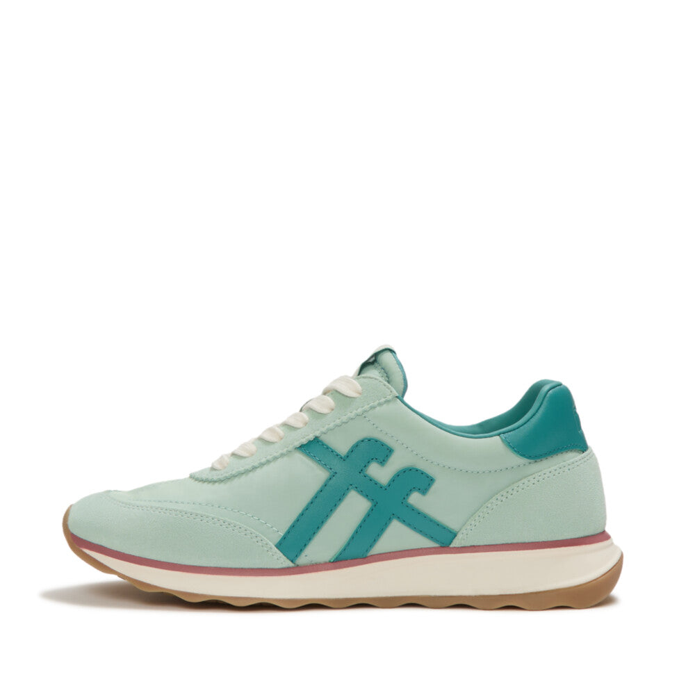 Light green sneaker with green accents on a white background