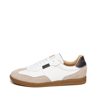 White sneaker with brown accents on a white background